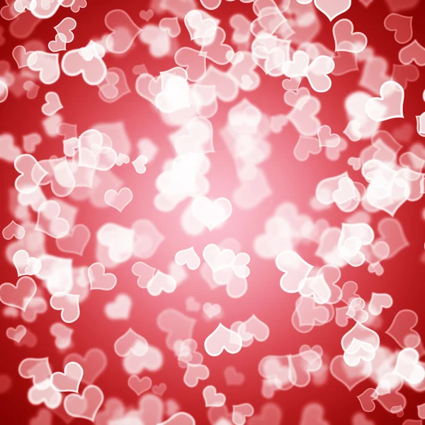 赤いハートの愛ロマンスとバレンタインを示す背景のボケ味 — ストック写真