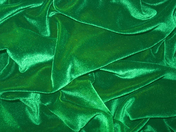 Gevouwen groene fluweel (velours) achtergrond — Stockfoto