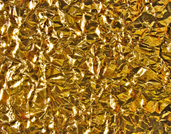Gold metal texture - crumpled foil — Stock Photo, Image