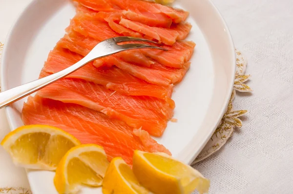 Raw salmon on plate — Stock Photo, Image