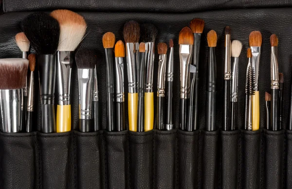 Makeup brushes in leather — Stock Photo, Image