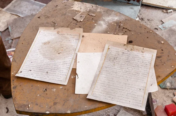 Old documents on dirty table — Zdjęcie stockowe