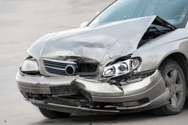 Damaged car on the road clipart