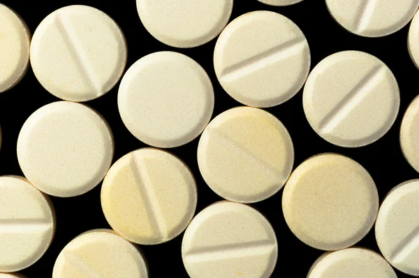 Orvosi tabletták fekete háttér — Stock Fotó