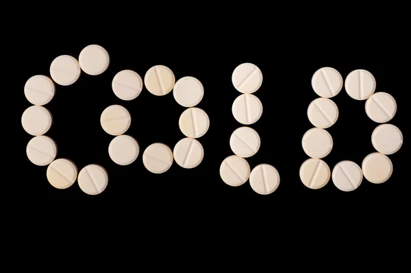 Cold word made out of medical Pills — Stock Photo, Image