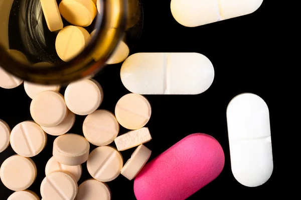 Pills on black background — Stock Photo, Image