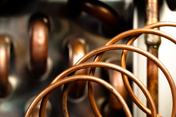 Close up of orange wires and pipes — Stock Photo, Image