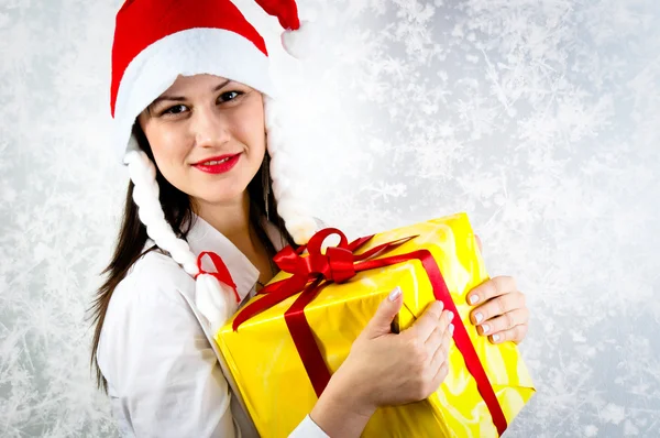 Young girl with joyful expression holding her present — Stock Photo, Image