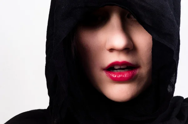Woman with black hood against white isolated background — Stock Photo, Image