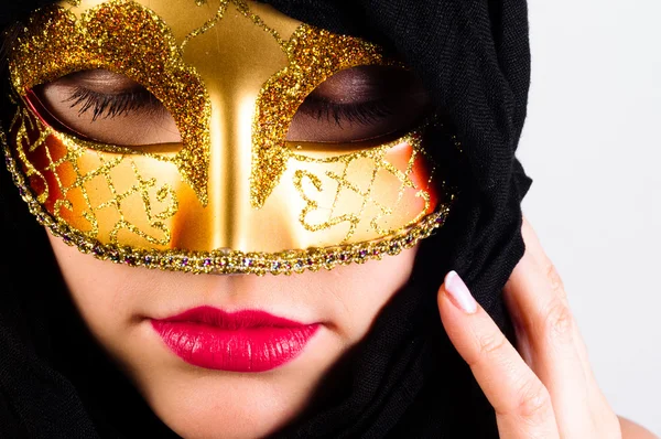 Carnival mask on a young attractive girl against white backgroun — Stock Photo, Image