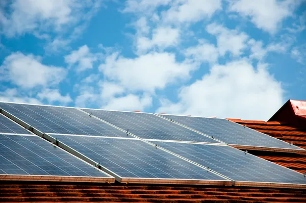 stock image Cells of solar energy panels on the roof of a building