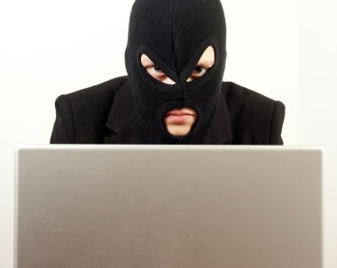 Woman internet hacker using laptop to rule the world clipart