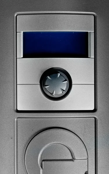Big grey switch and blue display on grey machine — Stock Photo, Image