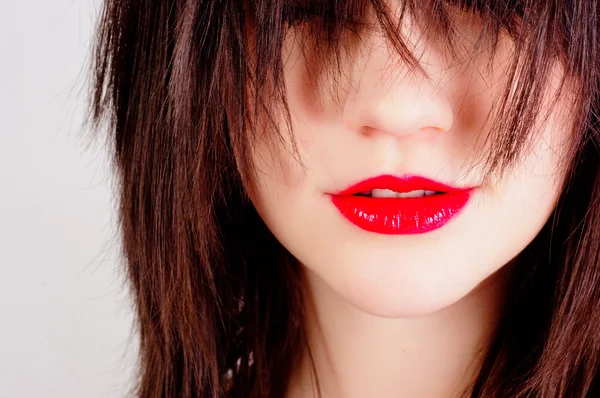 Närbild foto av en kvinna med röda läppar — Stockfoto