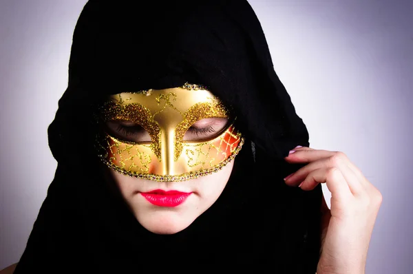 Closeup photo of a woman in black hood and red lips — Stock Photo, Image