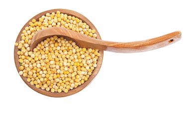 Yellow peas (cereals) in the bowl with wood spoon over white clipart