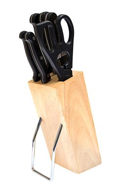 Kitchen knives in a wooden stand isolated on a white background clipart