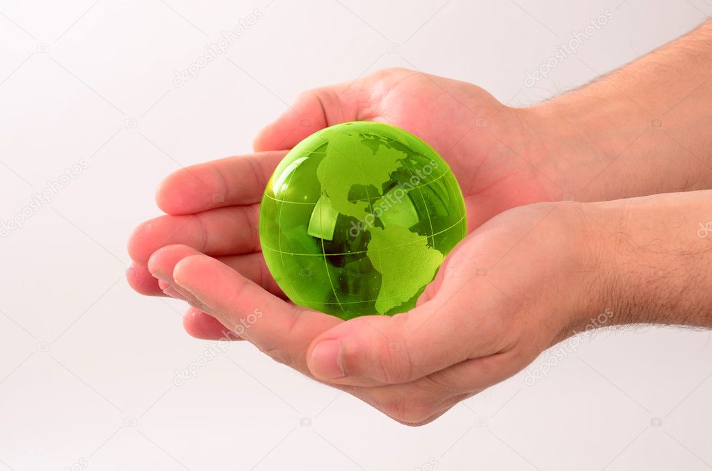 Glass globe in human hand