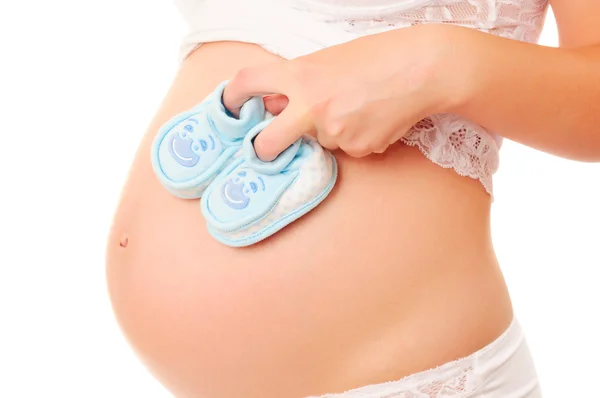 Mulheres grávidas e botas de bebê — Fotografia de Stock