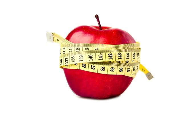 Rode appel met maatregel tape — Stockfoto
