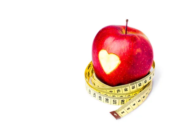 Červené jablko se symbolem srdce — Stock fotografie