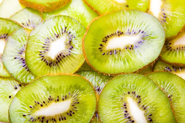 Pozadí plátky kiwi ovoce — Stock fotografie