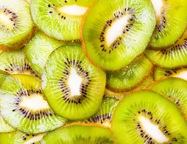 Achtergrond van gesneden kiwi 's — Stockfoto