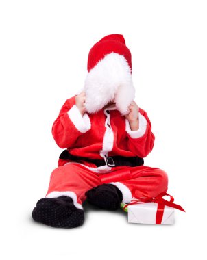 Portrait of little cute baby in red suite of Santa isolated