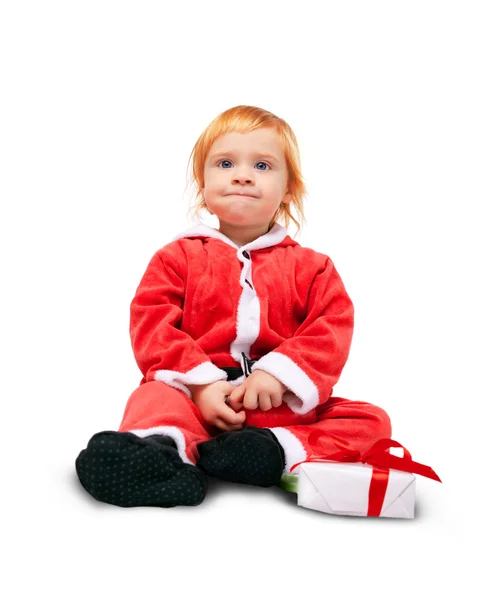 Porträt des kleinen süßen Babys in der roten Suite von Weihnachtsmann isoliert — Stockfoto