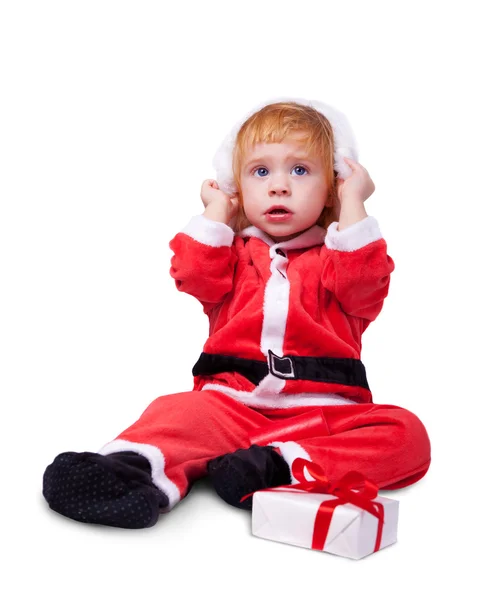 Portret słodkie maleństwo w Apartament czerwony na białym tle Santa — Zdjęcie stockowe