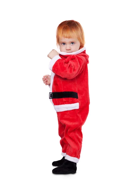 Retrato de pequeno bebê bonito na suíte vermelha de Santa isolado — Fotografia de Stock