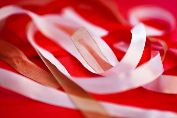 Group of ribbons on red background — Stock Photo, Image