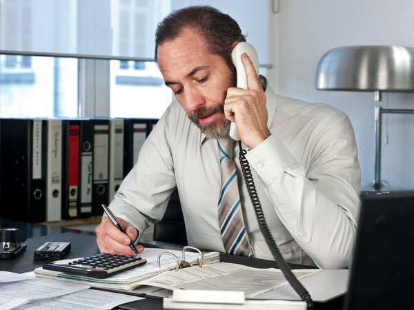 Businessman calculating finance