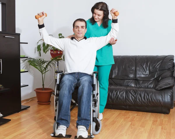 Physical therapist working with patient — Stock Photo, Image