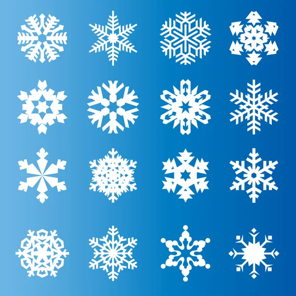 Płatki śniegu na niebieskim tle — Zdjęcie stockowe