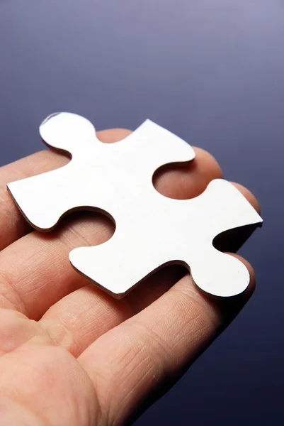 stock image Hand holding a puzzle piece