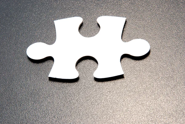Close up shot of a puzzle piece — Stock Photo, Image