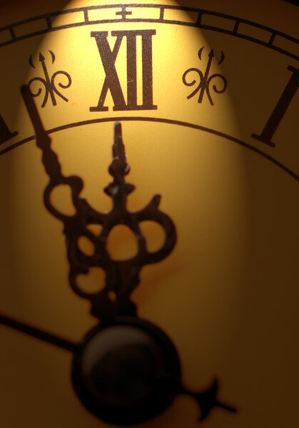 Clock showing time about twelve