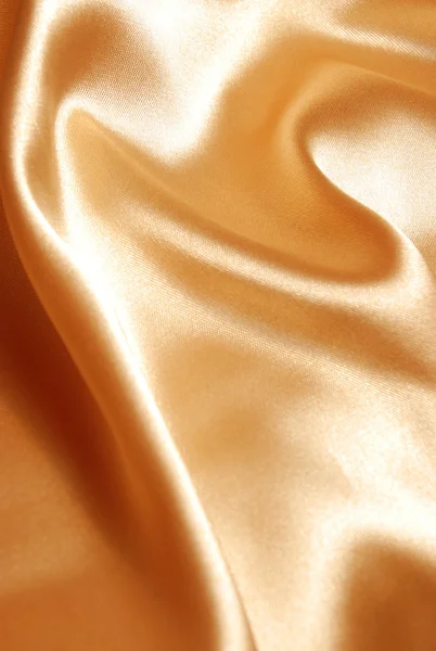 Элегантный золотой атласный фон — стоковое фото