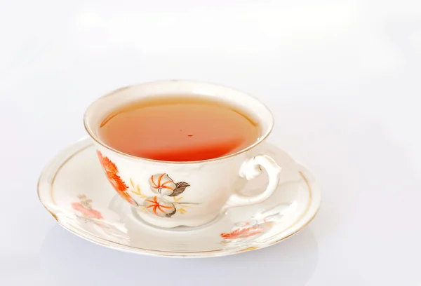 stock image Cup of tea over white