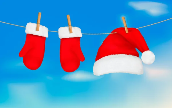 Chapeau de Père Noël et mitaines suspendues. Fond de Noël Illustration vectorielle — Image vectorielle