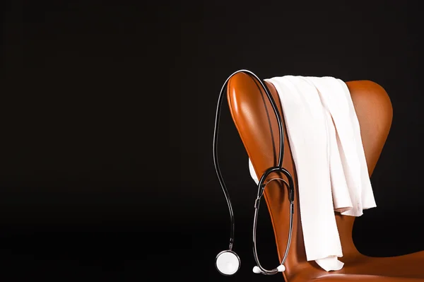 Stethoscope hanging over chair — Stock Photo, Image