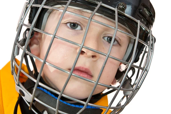 Netter Junge in gelber Eishockey-Uniform — Stockfoto
