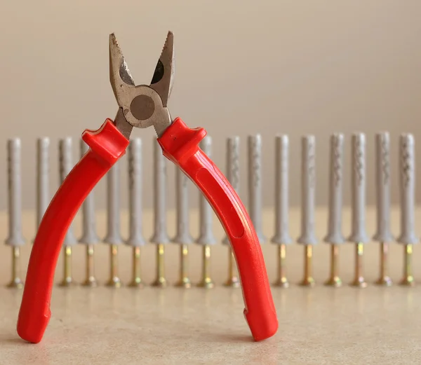 Pliers with dowels — Stock Photo, Image