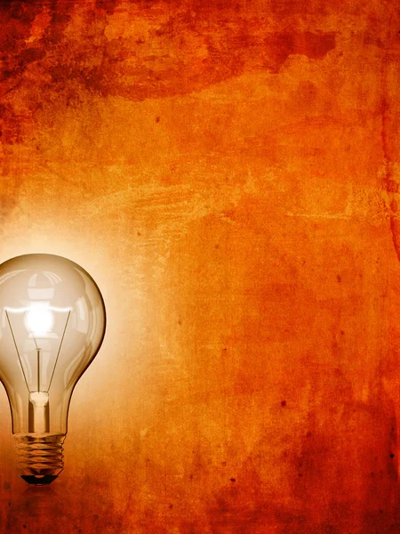 Lightbulb on grunge background — Stock Photo, Image