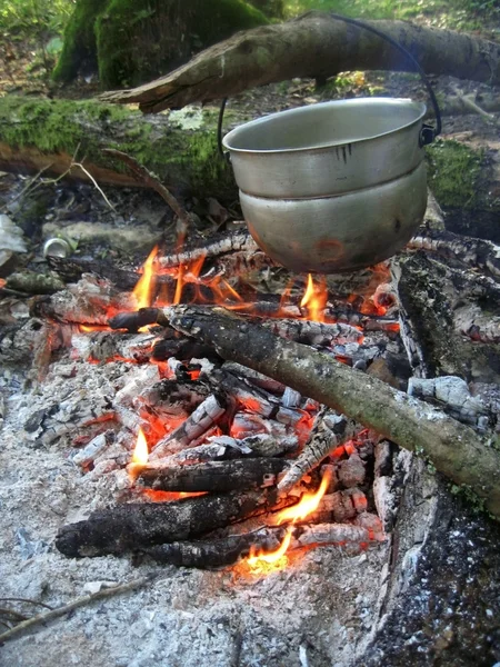 stock image Water for tea boiling on the bonfire