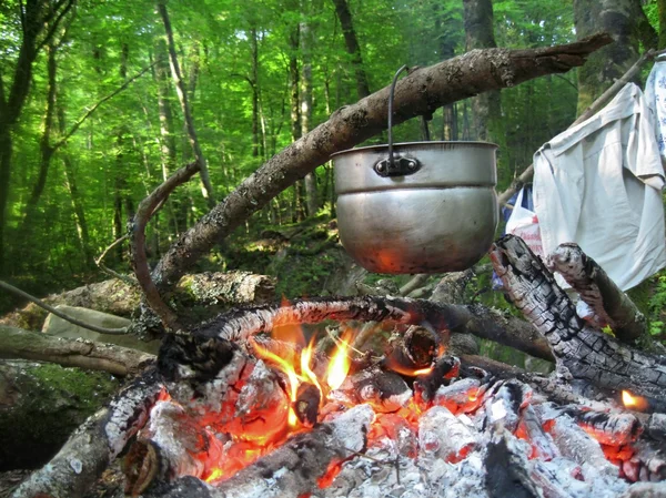 stock image Water for tea boiling on the bonfire