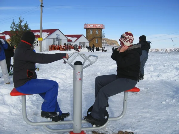 Two girls training on the winter ski apparatus — Stock Photo, Image