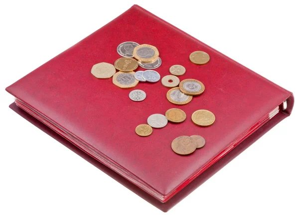Different coins on red numismatics album — Stock Photo, Image