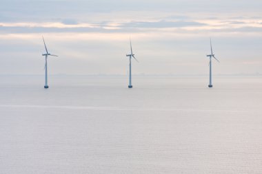 Offshore wind farm early morning clipart